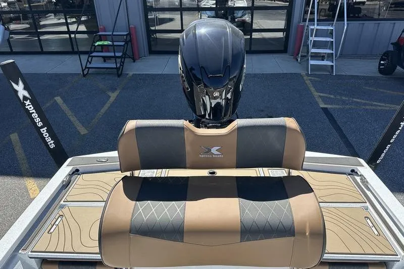 Slide: The Image of 2026 Xpress XR21 Bay boat with sleek seating and powerful outboard motor. - 20