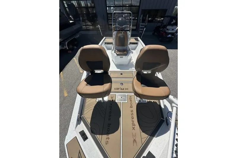 Slide: The Image of 2026 Xpress XR21 Bay boat with dual seats and console, showcasing modern design. - 4