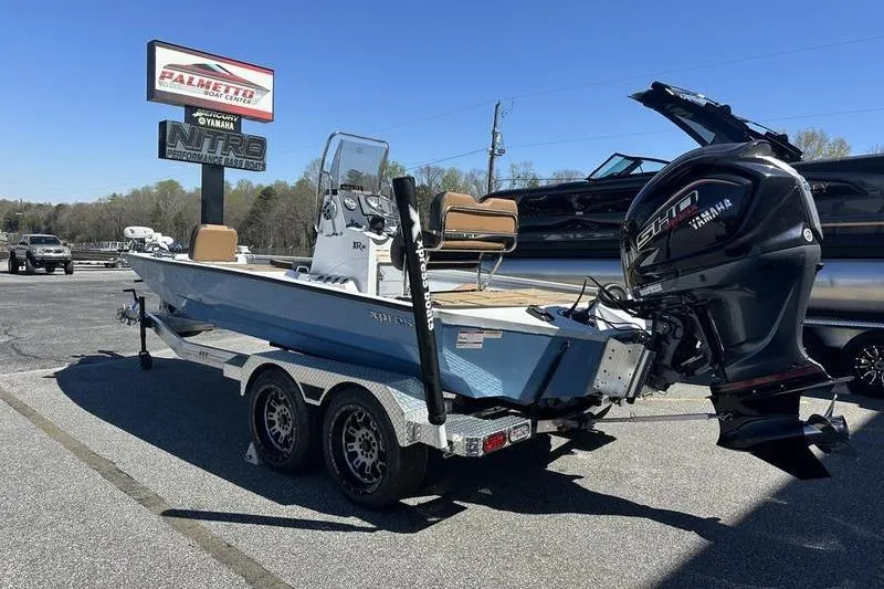 Slide: The Image of 2026 Xpress XR21 Bay boat with Yamaha engine on trailer at dealership. - 6