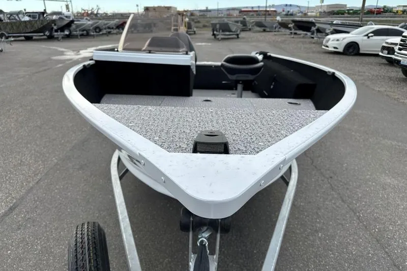 Slide: The Image of 2026 Smoker Craft Lazer 161 boat on trailer, parked in a lot. - 3