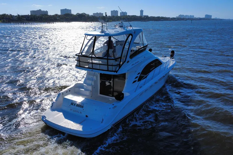 Slide: The Image of 2005 Sea Ray 500 Sedan Bridge yacht cruising on sunny waters. - 13