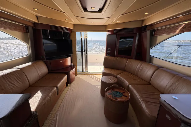 Slide: The Image of Luxurious interior of 2005 Sea Ray 500 Sedan Bridge yacht with leather seating and ocean view. - 27