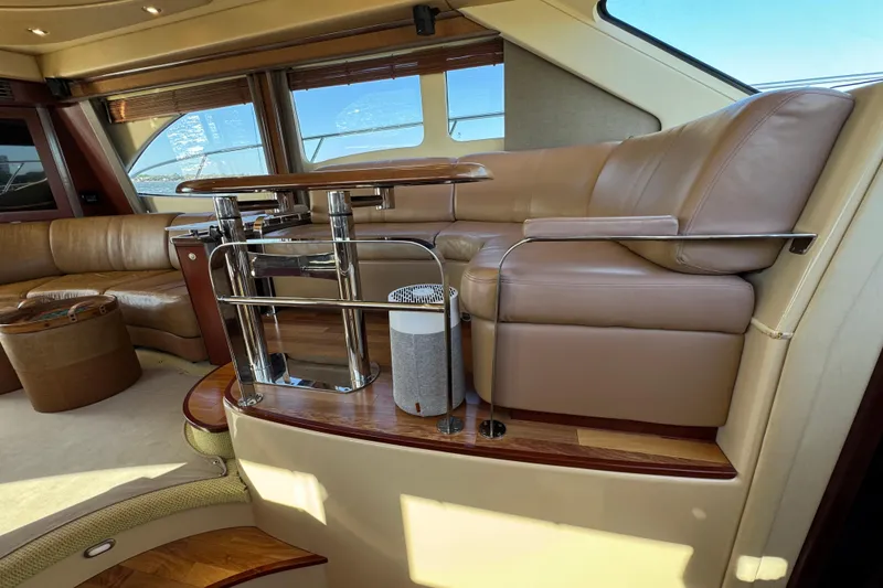 Slide: The Image of Luxurious interior of a 2005 Sea Ray 500 Sedan Bridge yacht with leather seating. - 33