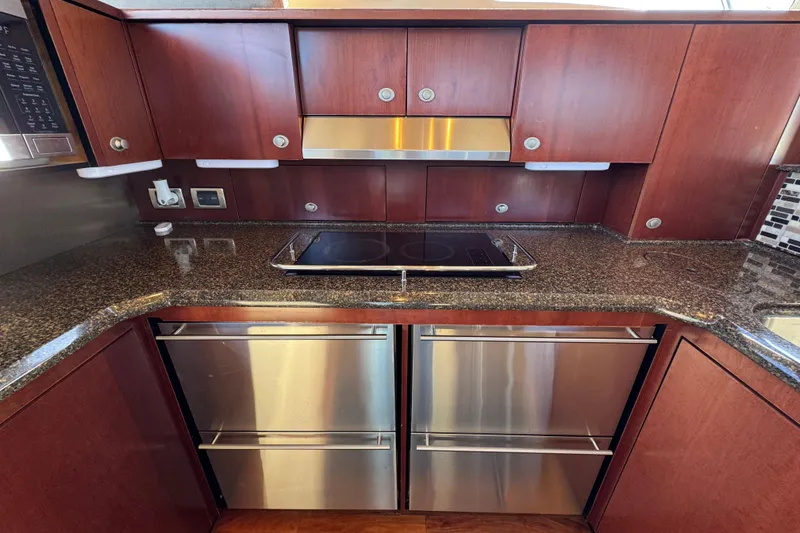 Slide: The Image of Luxurious kitchen interior of 2005 Sea Ray 500 Sedan Bridge yacht with modern appliances. - 36