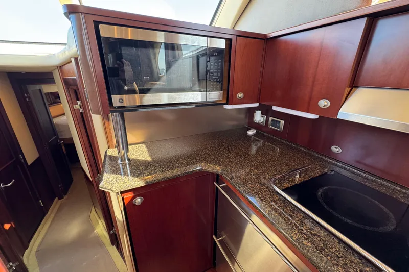 Slide: The Image of Luxurious kitchen interior of 2005 Sea Ray 500 Sedan Bridge yacht. - 37