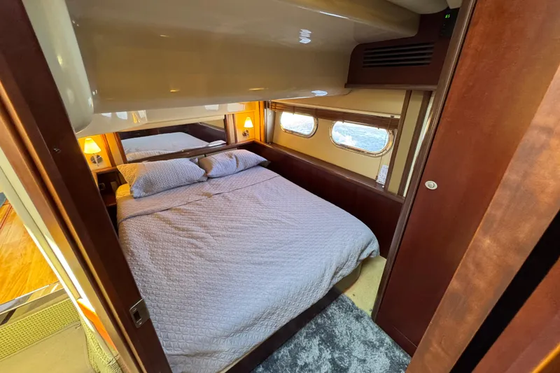 Slide: The Image of Luxurious bedroom interior of 2005 Sea Ray 500 Sedan Bridge yacht. - 40