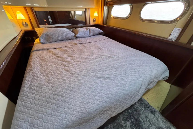 Slide: The Image of Luxurious bedroom interior of 2005 Sea Ray 500 Sedan Bridge yacht. - 41