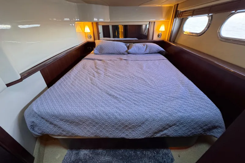 Slide: The Image of Luxurious bedroom interior of 2005 Sea Ray 500 Sedan Bridge yacht. - 43