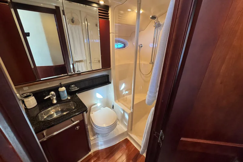 Slide: The Image of Luxurious bathroom in 2005 Sea Ray 500 Sedan Bridge yacht with shower and vanity. - 44