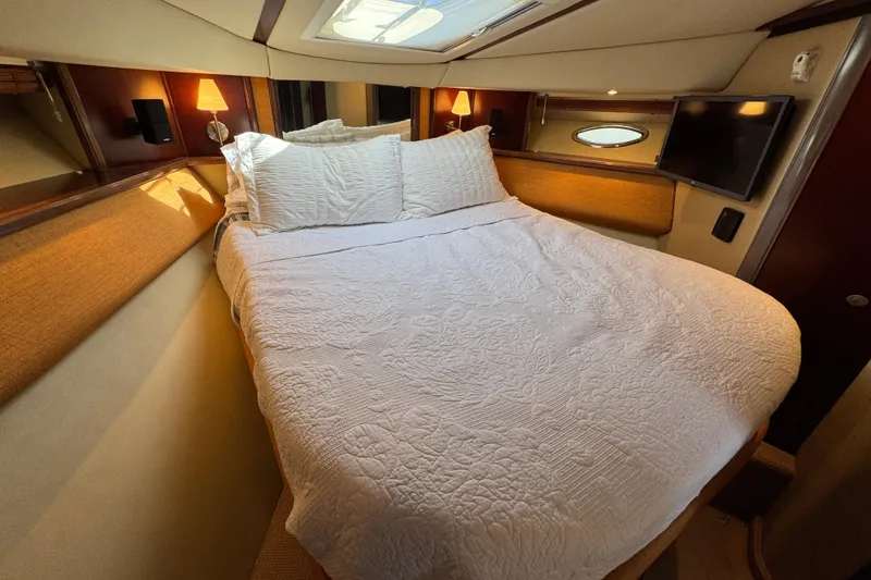 Slide: The Image of Luxurious bedroom interior of 2005 Sea Ray 500 Sedan Bridge yacht. - 45