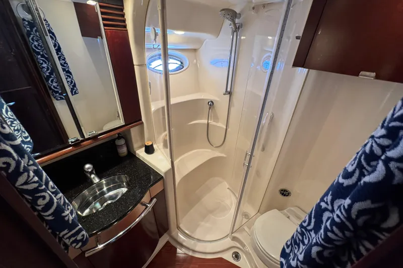 Slide: The Image of Luxurious bathroom in 2005 Sea Ray 500 Sedan Bridge yacht with shower and sink. - 47