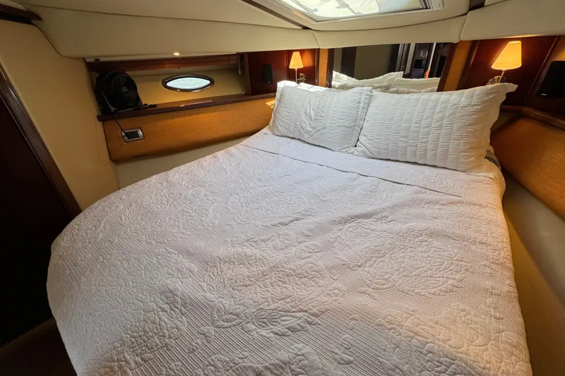 Slide: The Image of Luxurious bedroom interior of 2005 Sea Ray 500 Sedan Bridge yacht. - 48