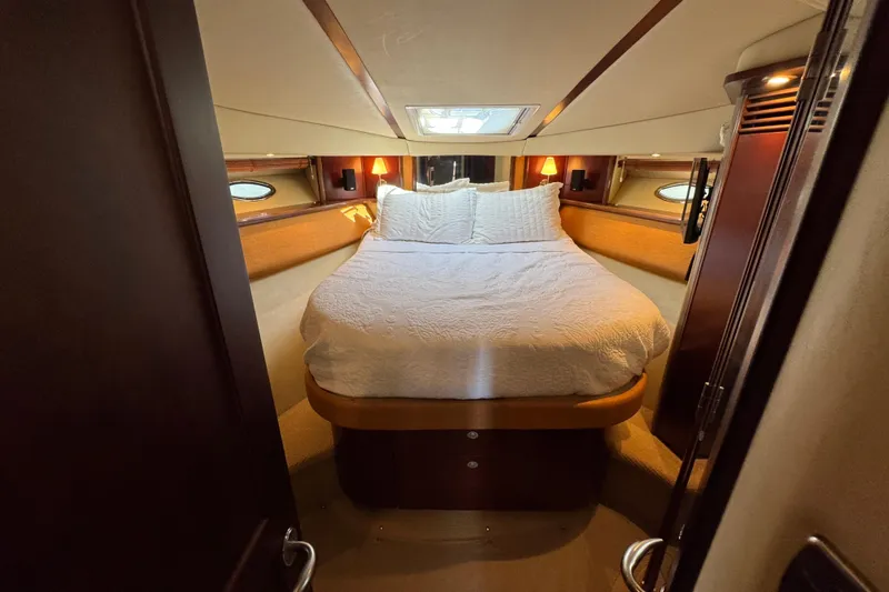 Slide: The Image of Luxurious bedroom interior of 2005 Sea Ray 500 Sedan Bridge yacht. - 49