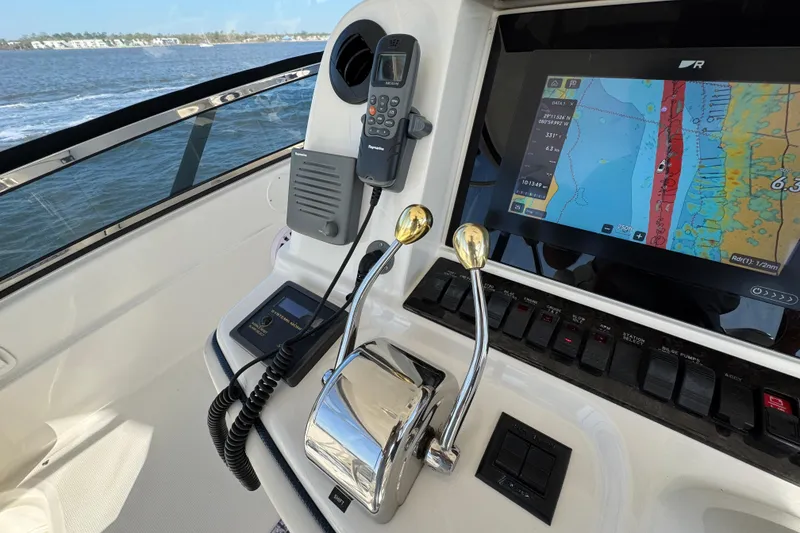 Slide: The Image of Control panel of a 2005 Sea Ray 500 Sedan Bridge with navigation display. - 55