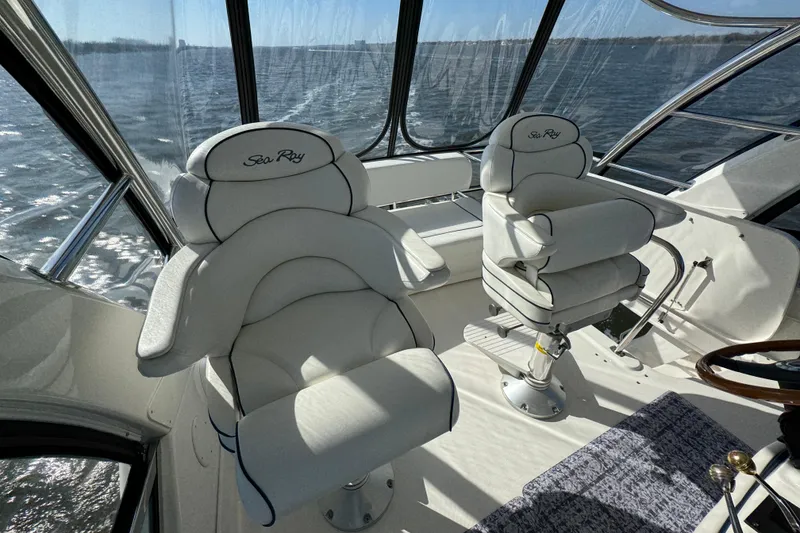 Slide: The Image of Luxurious cockpit seating on 2005 Sea Ray 500 Sedan Bridge yacht. - 59