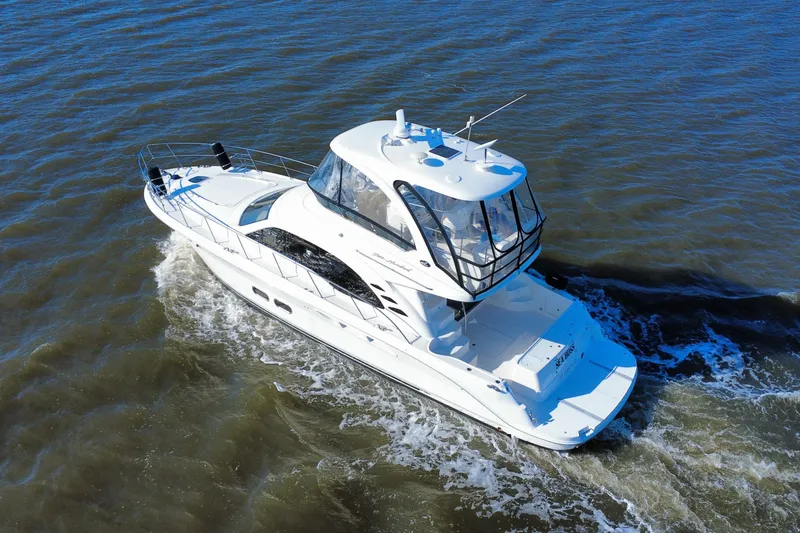 Slide: The Image of 2005 Sea Ray 500 Sedan Bridge yacht cruising on open water. - 6