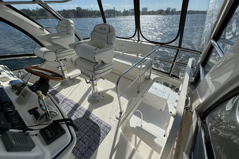 Slide: The Image of Interior view of 2005 Sea Ray 500 Sedan Bridge yacht with helm and seating. - 61