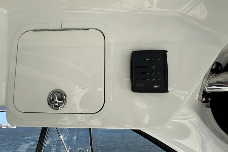 Slide: The Image of Control panel and storage compartment on a 2005 Sea Ray 500 Sedan Bridge yacht. - 62