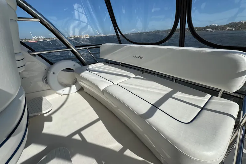 Slide: The Image of Luxurious interior of 2005 Sea Ray 500 Sedan Bridge yacht with white seating. - 64