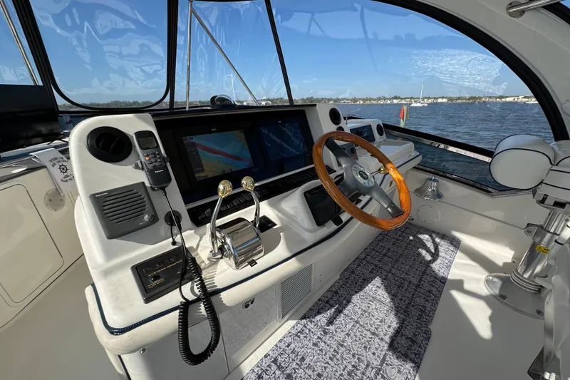 Slide: The Image of Interior helm of 2005 Sea Ray 500 Sedan Bridge yacht with navigation equipment. - 65