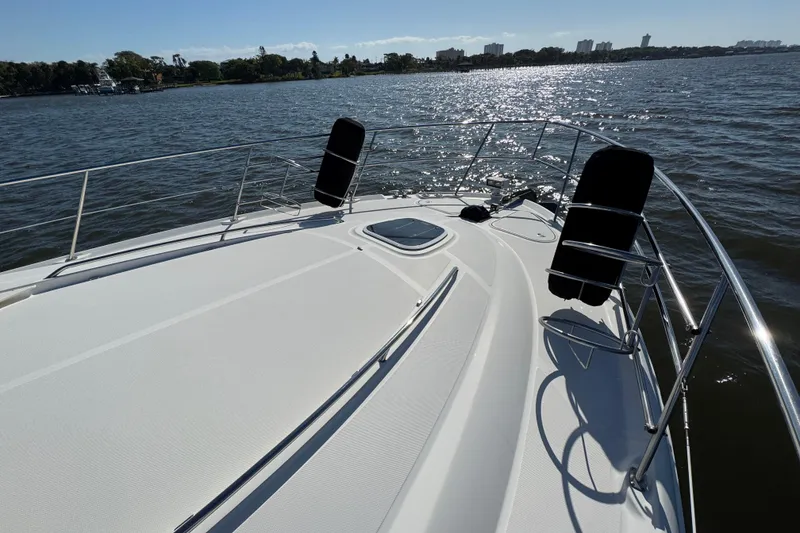 Slide: The Image of 2005 Sea Ray 500 Sedan Bridge yacht deck with ocean view and sunny skies. - 68