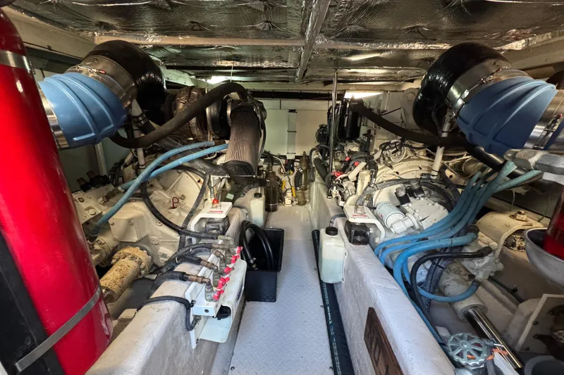 Slide: The Image of Engine room of a 2005 Sea Ray 500 Sedan Bridge yacht, showcasing dual engines and components. - 69