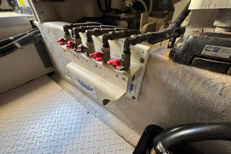 Slide: The Image of Engine room of 2005 Sea Ray 500 Sedan Bridge with Reverso oil change system. - 70