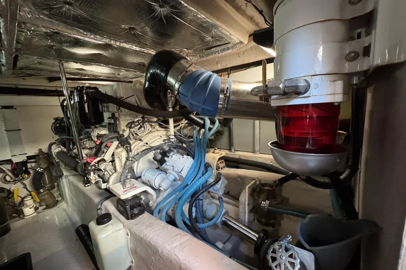 Slide: The Image of Engine room of a 2005 Sea Ray 500 Sedan Bridge with visible components and wiring. - 71