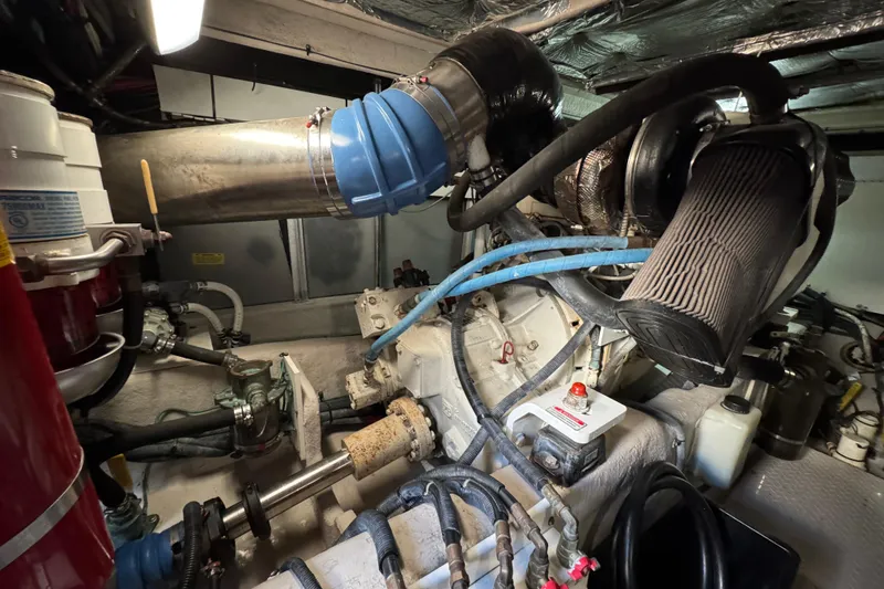 Slide: The Image of Engine room of a 2005 Sea Ray 500 Sedan Bridge yacht, showcasing mechanical components. - 73