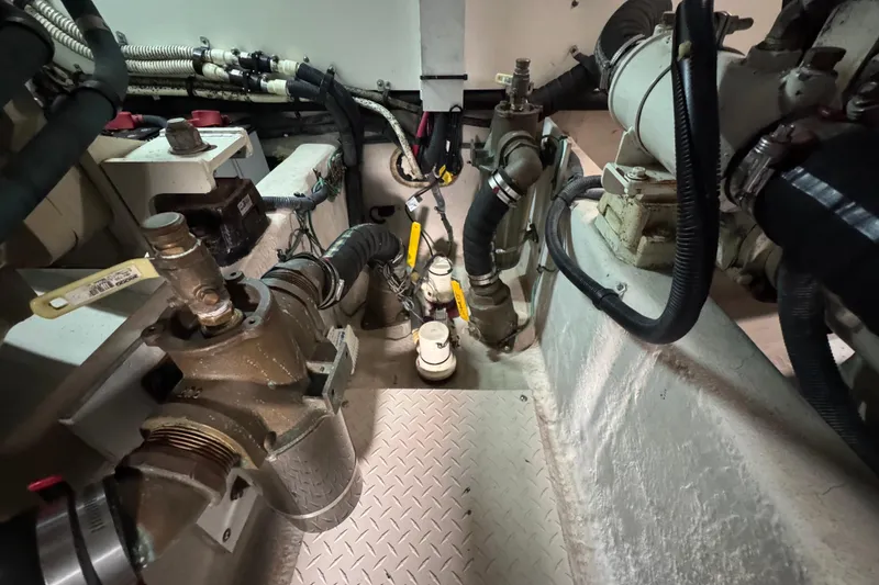 Slide: The Image of Engine room of 2005 Sea Ray 500 Sedan Bridge with visible mechanical components. - 75