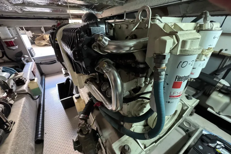Slide: The Image of Engine room of a 2005 Sea Ray 500 Sedan Bridge yacht, showcasing detailed machinery. - 76