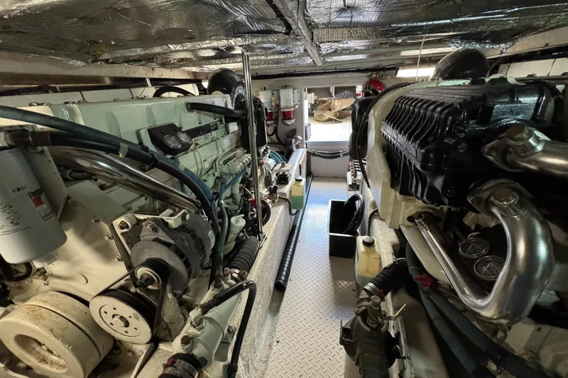 Slide: The Image of Engine room of a 2005 Sea Ray 500 Sedan Bridge yacht, showcasing dual engines. - 78