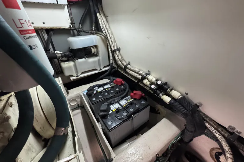 Slide: The Image of Engine room of 2005 Sea Ray 500 Sedan Bridge with batteries and wiring. - 79