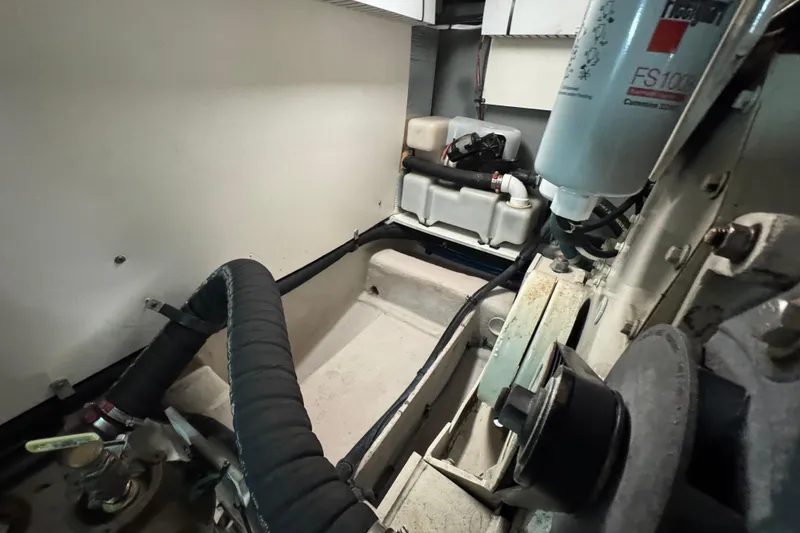 Slide: The Image of Engine room of a 2005 Sea Ray 500 Sedan Bridge, showcasing mechanical components. - 80