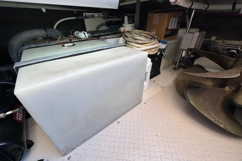 Slide: The Image of Engine room of 2005 Sea Ray 500 Sedan Bridge with equipment and propeller. - 86