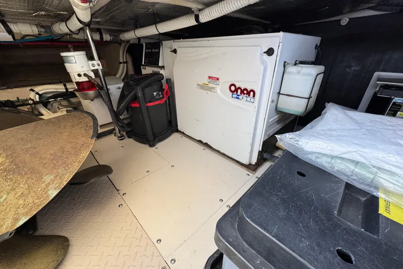 Slide: The Image of Engine room of 2005 Sea Ray 500 Sedan Bridge with Onan generator and equipment. - 87