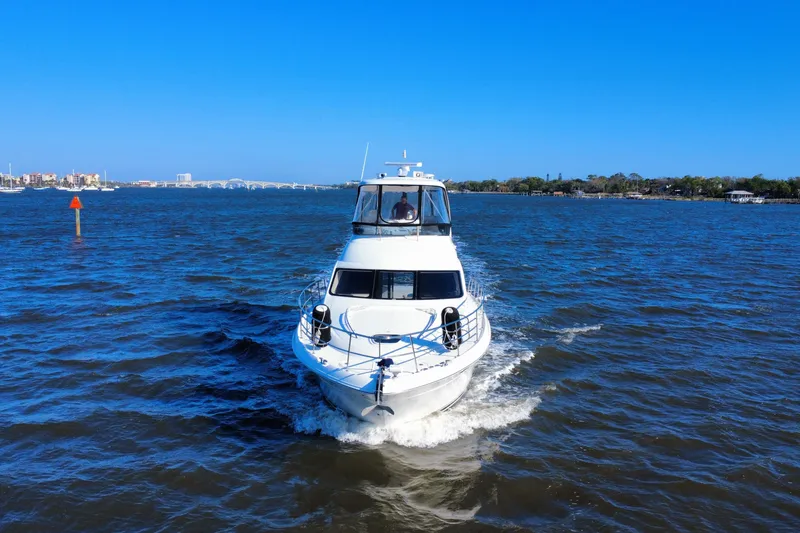 Slide: The Image of 2005 Sea Ray 500 Sedan Bridge cruising on a sunny day in open waters. - 9