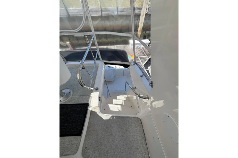 Slide: The Image of 1999 Sea Ray 480 Sedan Bridge yacht interior with stairs and railing. - 35