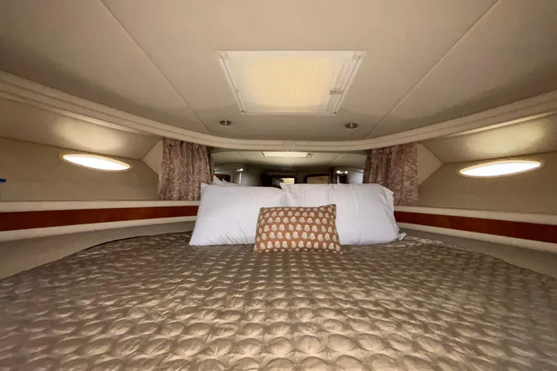 Slide: The Image of Luxurious cabin interior of 1999 Sea Ray 480 Sedan Bridge yacht with cozy bedding. - 73