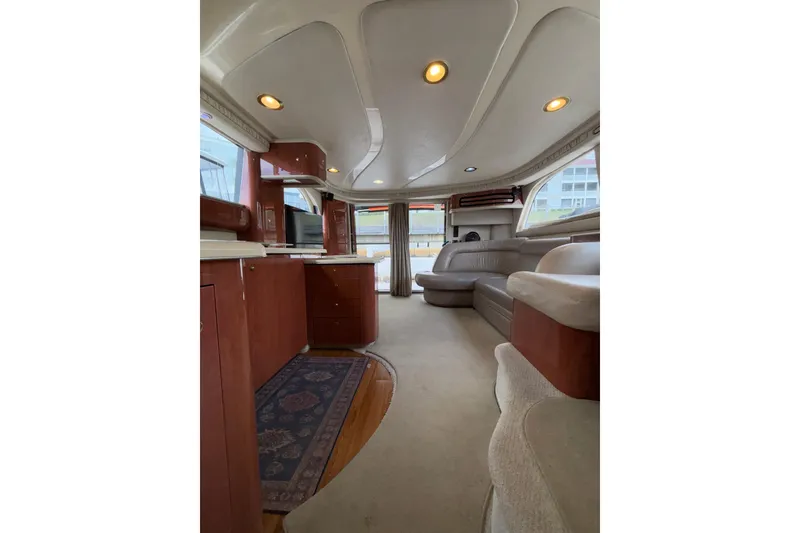 Slide: The Image of Luxurious interior of a 1999 Sea Ray 480 Sedan Bridge yacht with elegant furnishings. - 50