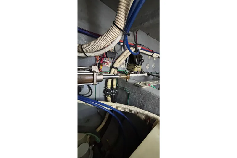 Slide: The Image of Engine room wiring and components of a 1999 Sea Ray 480 Sedan Bridge yacht. - 101
