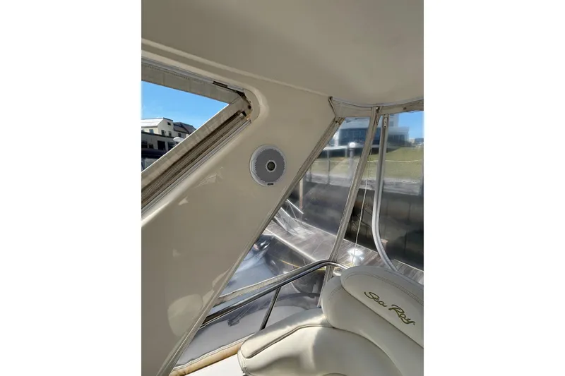 Slide: The Image of Interior view of a 1999 Sea Ray 480 Sedan Bridge yacht with speaker and seating. - 31