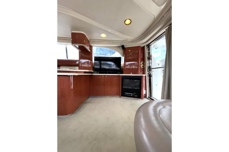 Slide: The Image of Luxurious interior of 1999 Sea Ray 480 Sedan Bridge yacht with modern amenities and elegant design. - 48