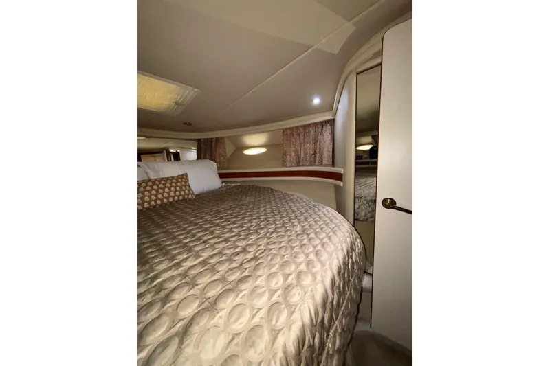 Slide: The Image of Luxurious bedroom interior of 1999 Sea Ray 480 Sedan Bridge yacht. - 72