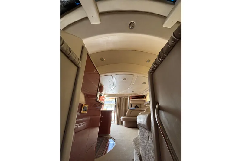 Slide: The Image of Interior of 1999 Sea Ray 480 Sedan Bridge yacht, featuring luxurious seating and elegant design. - 67
