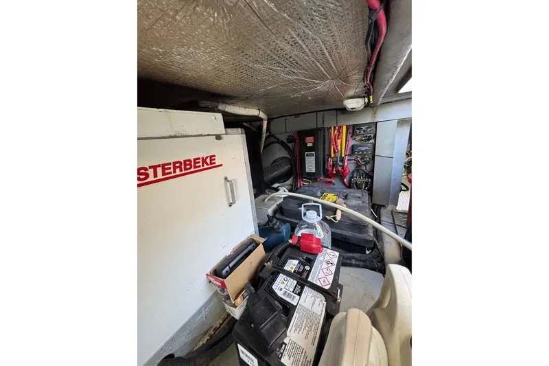 Slide: The Image of Engine room of 1999 Sea Ray 480 Sedan Bridge with Westerbeke generator and electrical components. - 102
