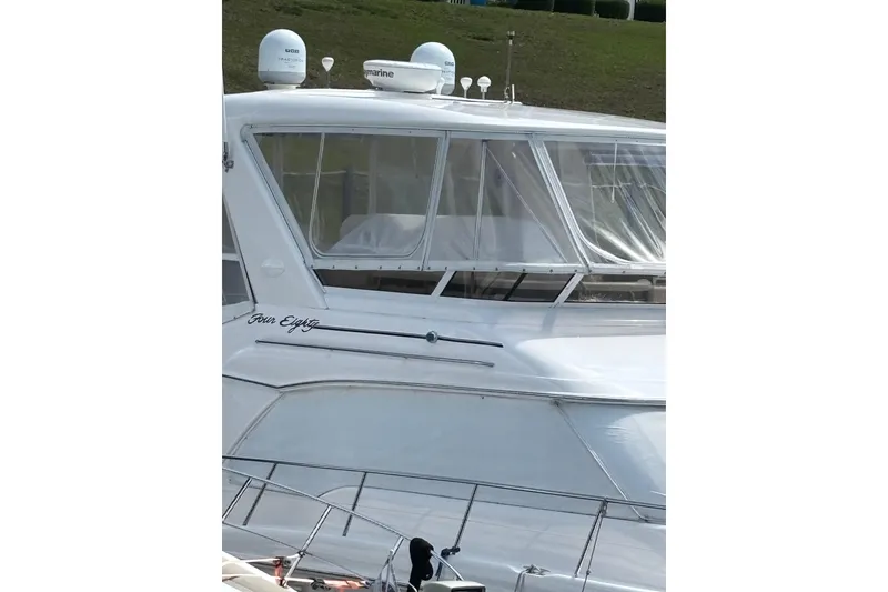 Slide: The Image of 1999 Sea Ray 480 Sedan Bridge yacht with enclosed bridge and radar equipment. - 15