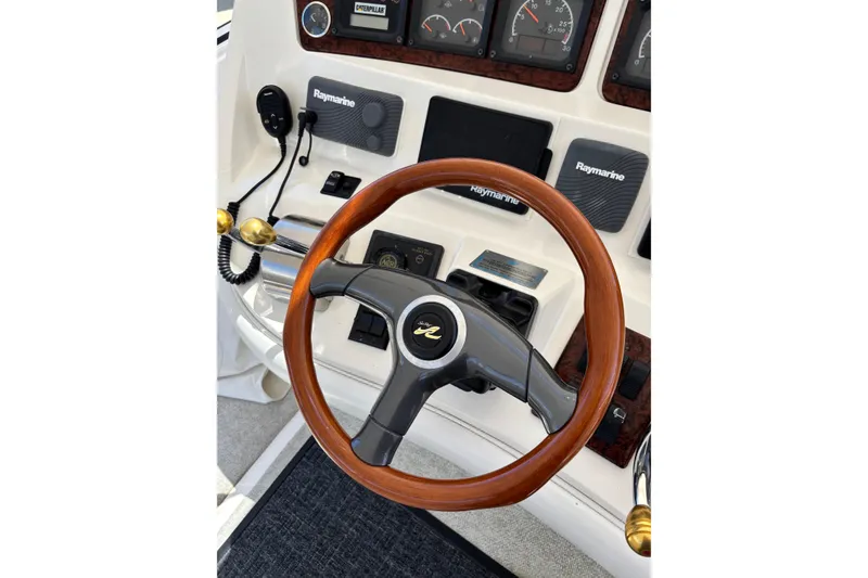 Slide: The Image of Steering wheel and dashboard of a 1999 Sea Ray 480 Sedan Bridge yacht. - 21