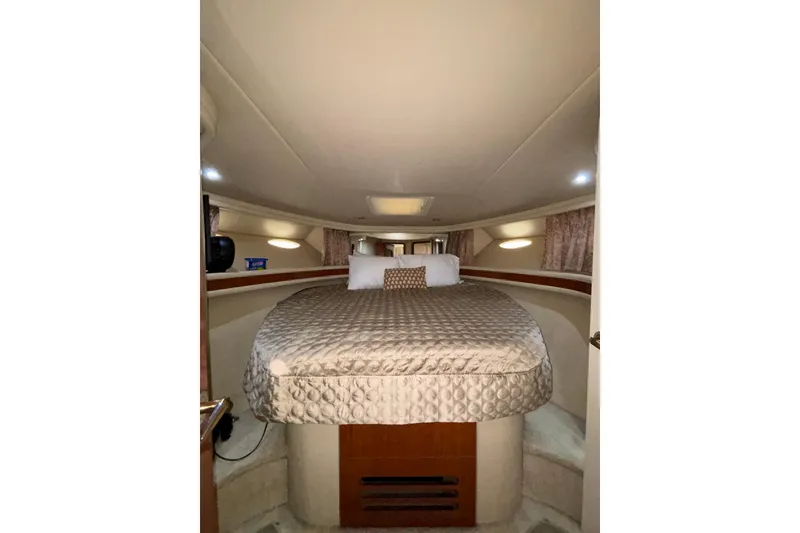 Slide: The Image of Luxurious cabin interior of 1999 Sea Ray 480 Sedan Bridge yacht with cozy bedding. - 69