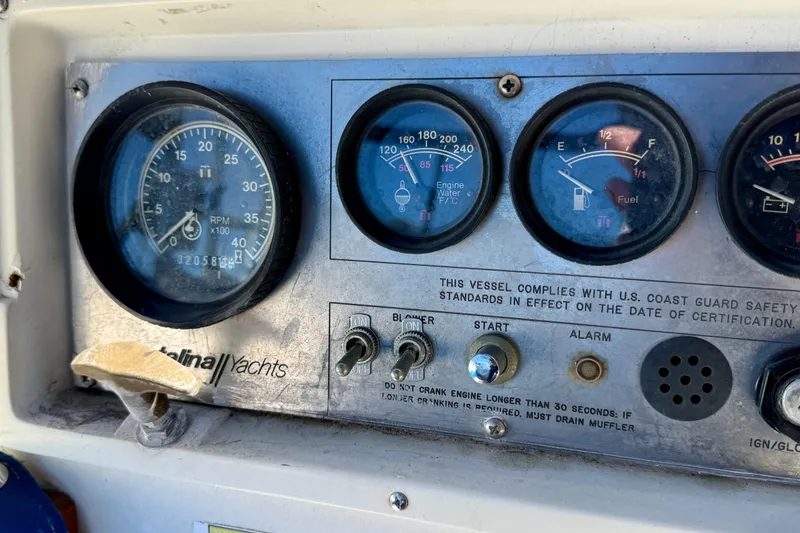Slide: The Image of Dashboard of a 1988 Catalina 34 yacht with gauges and controls. - 11